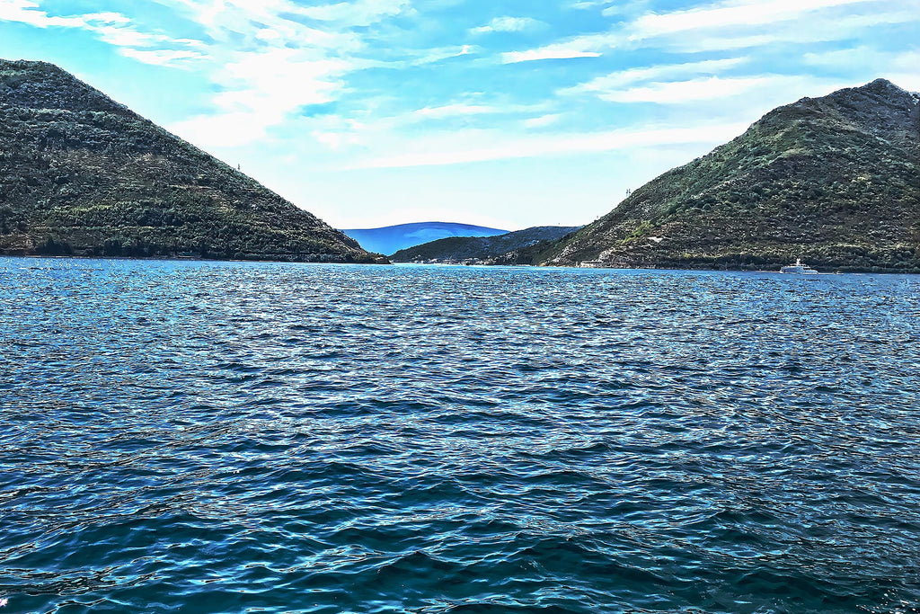 Italy coastal sea landscape with turquoise waters, rocky shoreline, and Mediterranean charm — digital wall art print for beach house decor, nautical theme rooms, or travel-inspired spaces.
